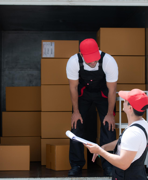 Moving team checking inventory and paperwork inside moving truck – Easy Best Moves