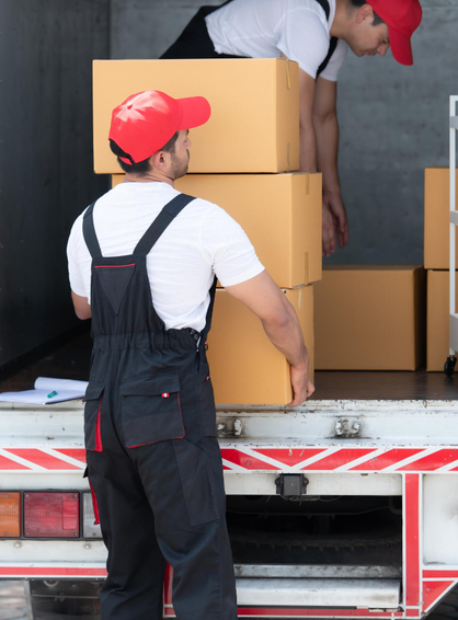 Mover lifting stacked boxes from truck for safe delivery – Easy Best Moves