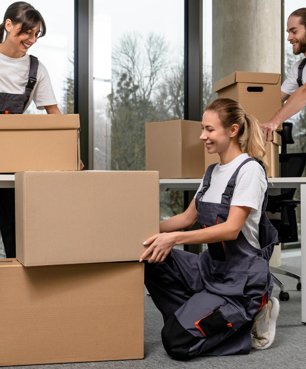 Movers carefully wrapping and packing in an office – Easy Best Moves