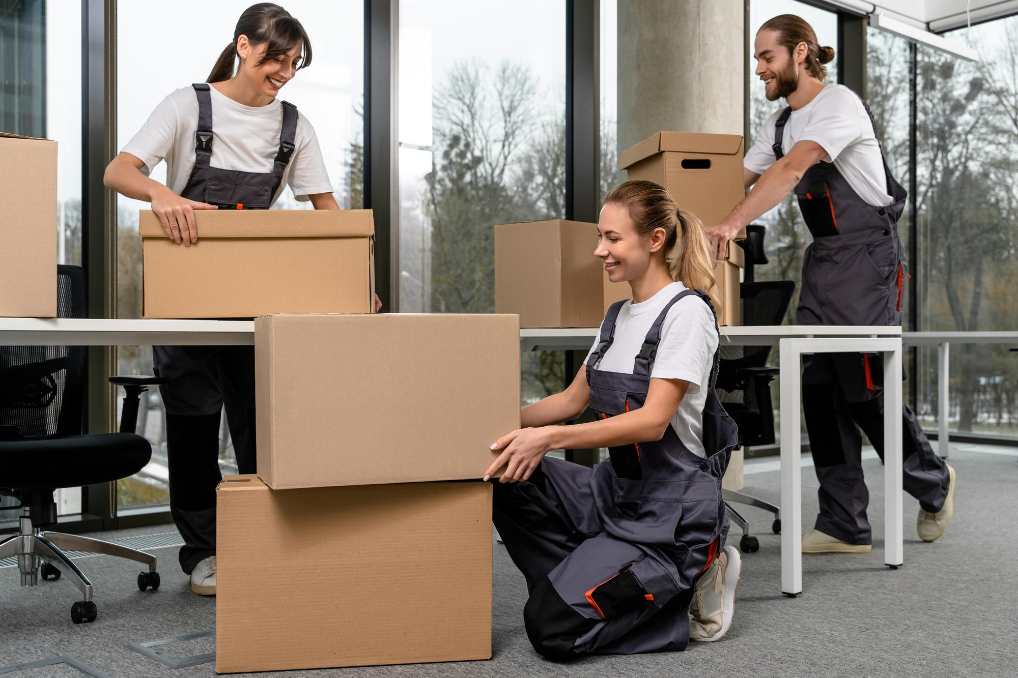 Office moving service inner image showing movers carefully handling furniture in office – Easy Best Move