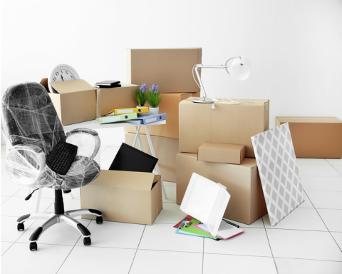 Office moving service video image showing movers carefully loading office furniture into moving truck – Easy Best Move