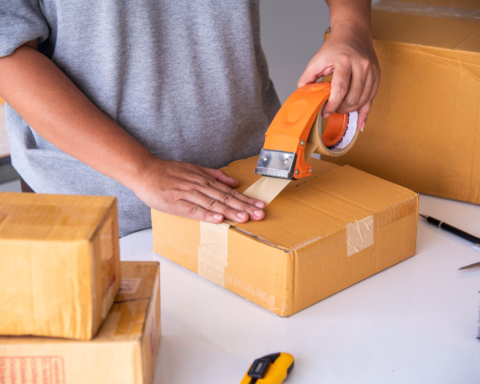 Packer wrapping fragile items with bubble wrap for secure moving – Easy Best Move